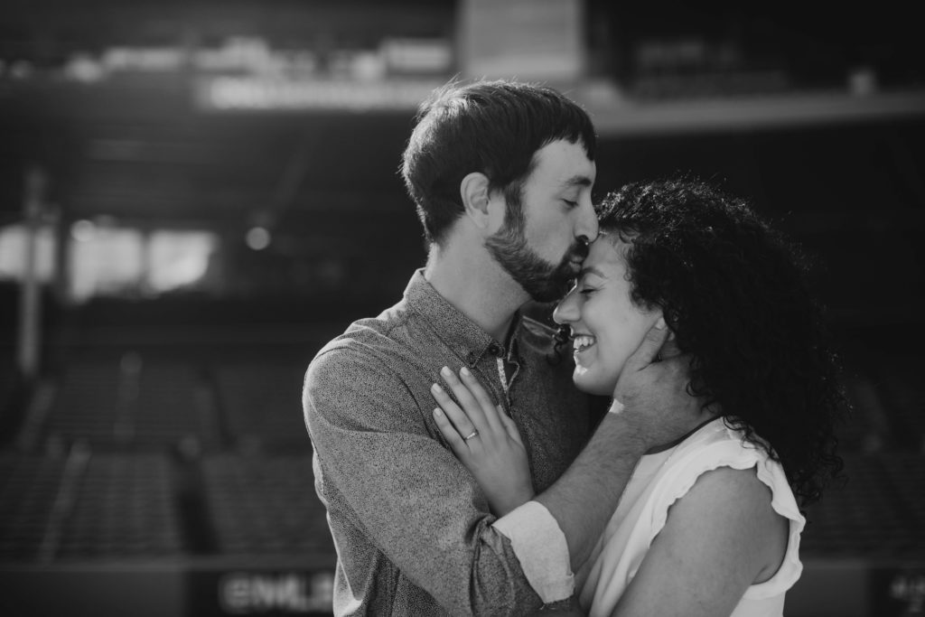 Couple embraces during their Boston engagement photos