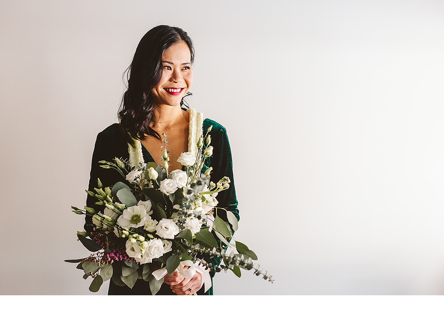 Boston-bride-poses-with-bridal-bouquet-with-eucalyptus-and-white-flowers