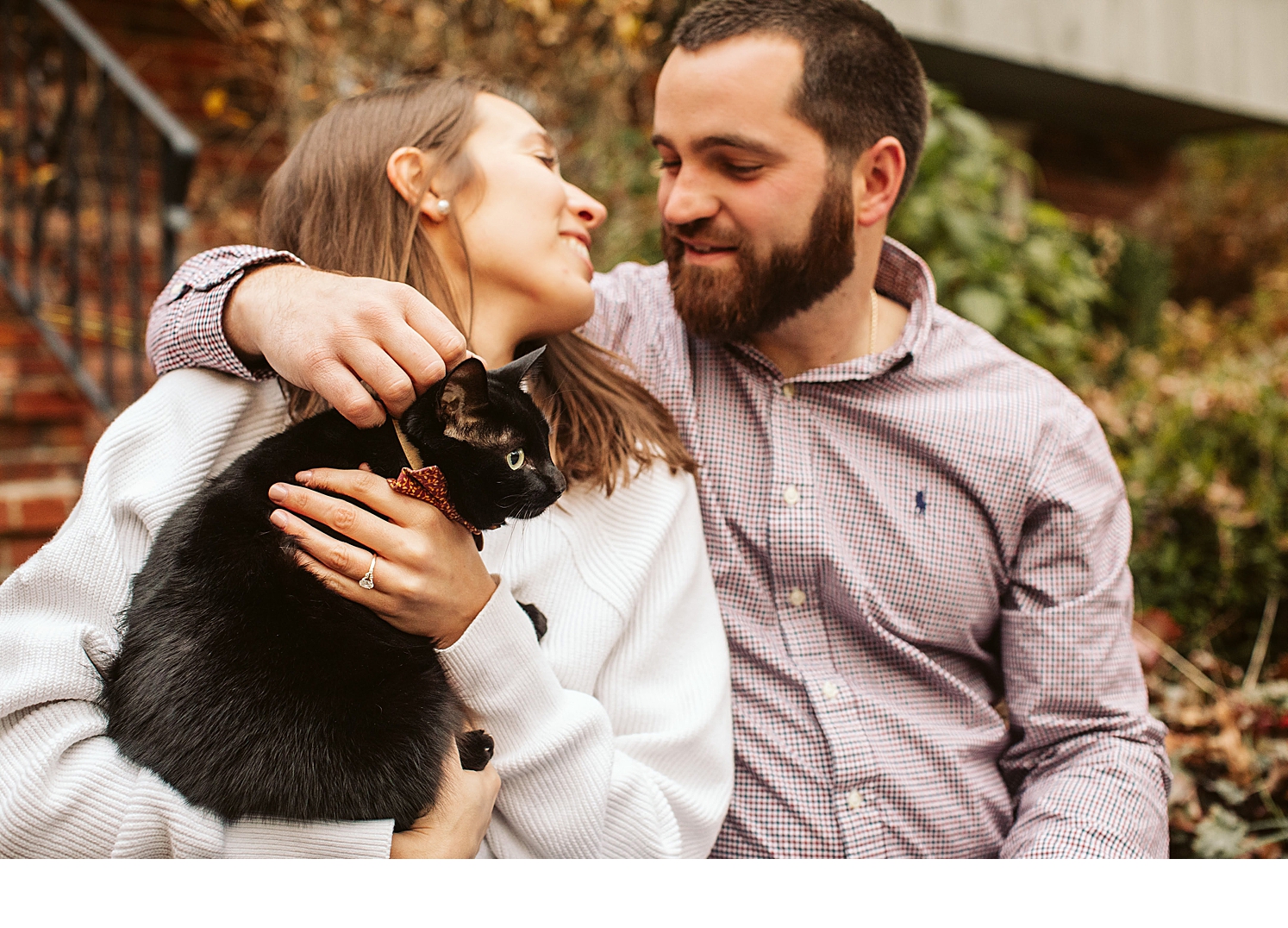 New England couple embraces during their at home engagement photos