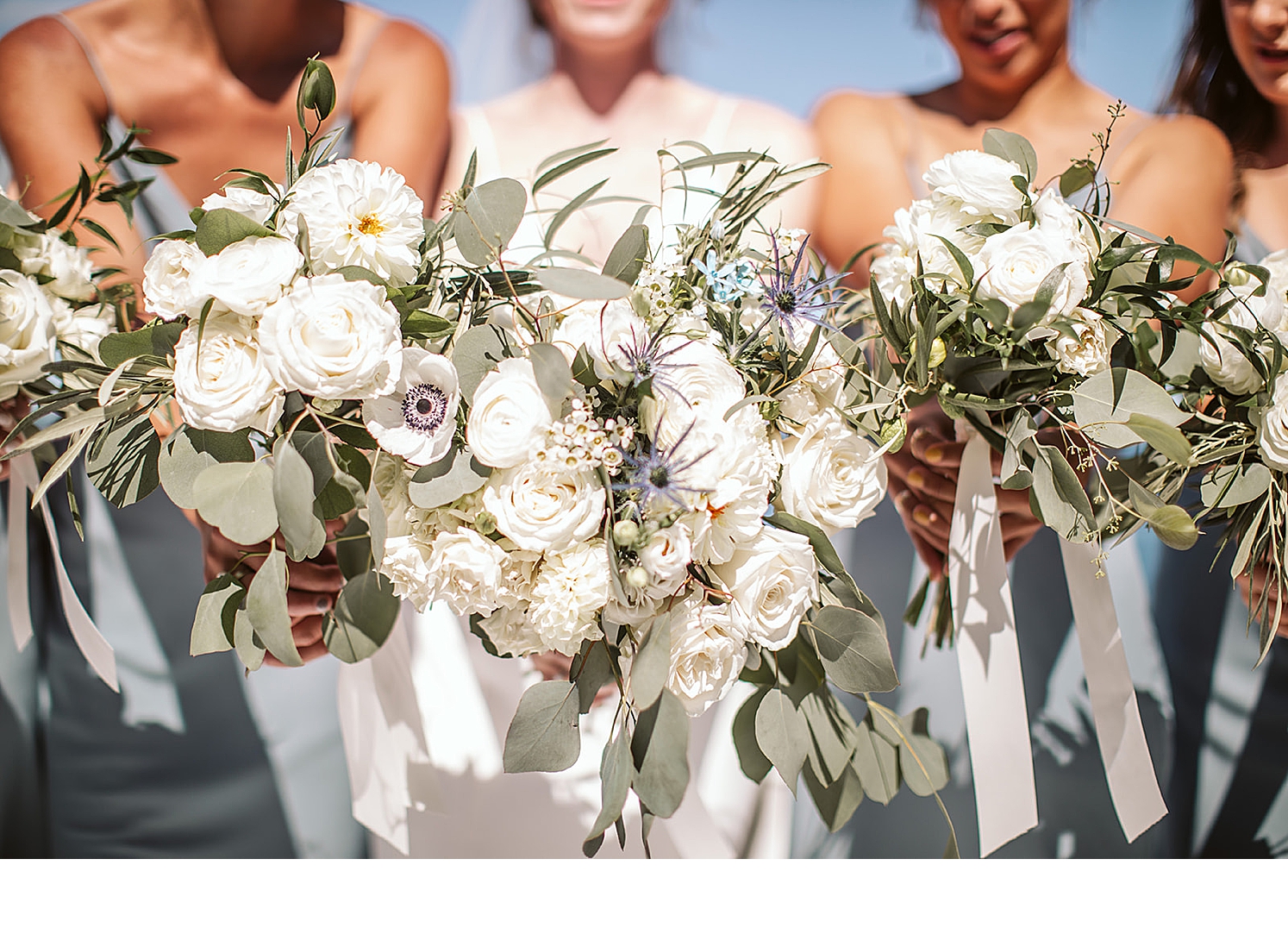 All-white-bridal-bouquet-with-white-roses-poppy-and-dahlias
