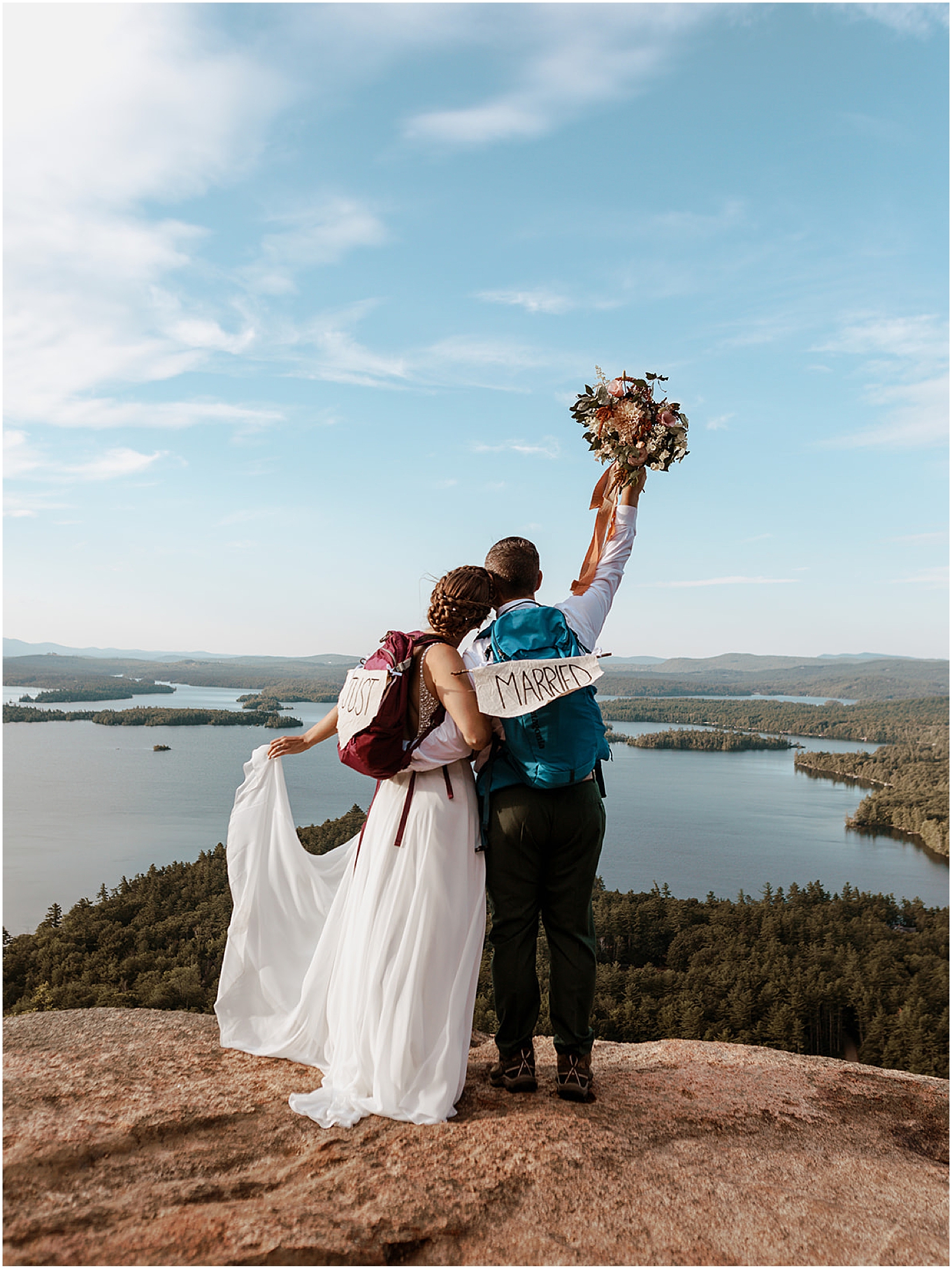 couple-with-just-married-signs-for-mountain-elopement